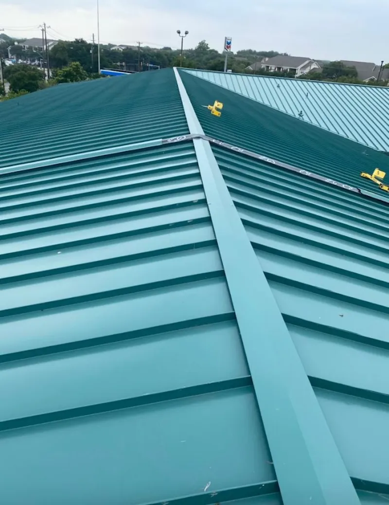 Green commercial metal roof ridge and valley for Metal Roof Repair in Fairhope